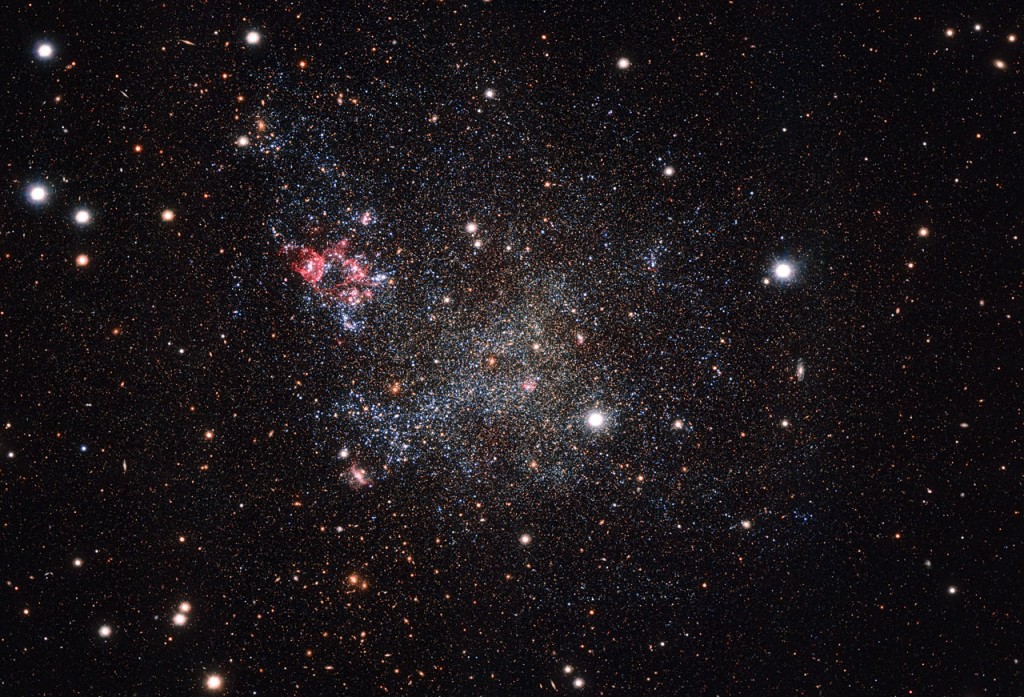 This image, captured with the OmegaCAM camera on ESO’s VLT Survey Telescope in Chile, shows an unusually clean small galaxy. IC 1613 contains very little cosmic dust, allowing astronomers to explore its contents with great clarity.